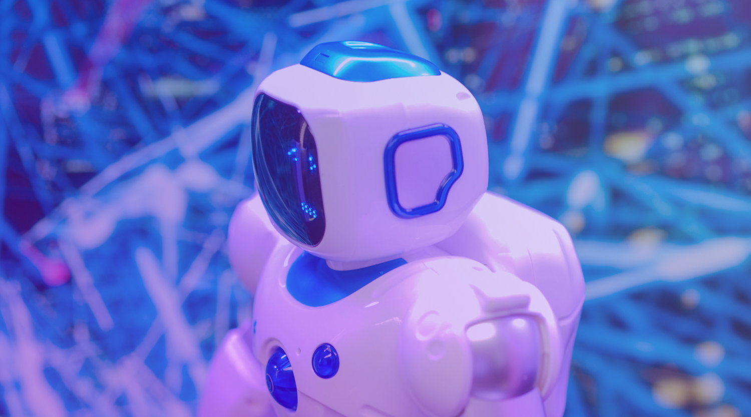 A  white robot, signifying the use of artificial intelligence. 